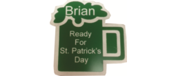 A 3" X 3" St. Patrick's Day badge with a pin backing. - Wear your personalized Irish saying on a green mug badge.